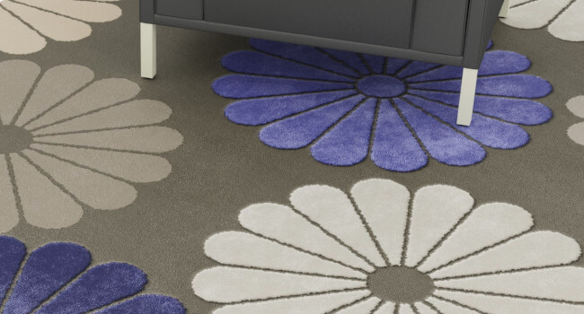 Floral hand-tufted rug with high-low floral elements.